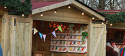 Wooden walk-in market chalet at a festive outdoor market
