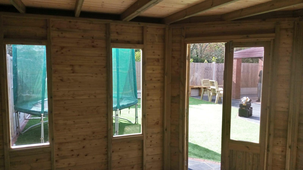 Corner timber summerhouse with integrated shed storage