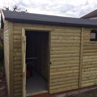 Wooden garage and storage shed in pressure treated timber