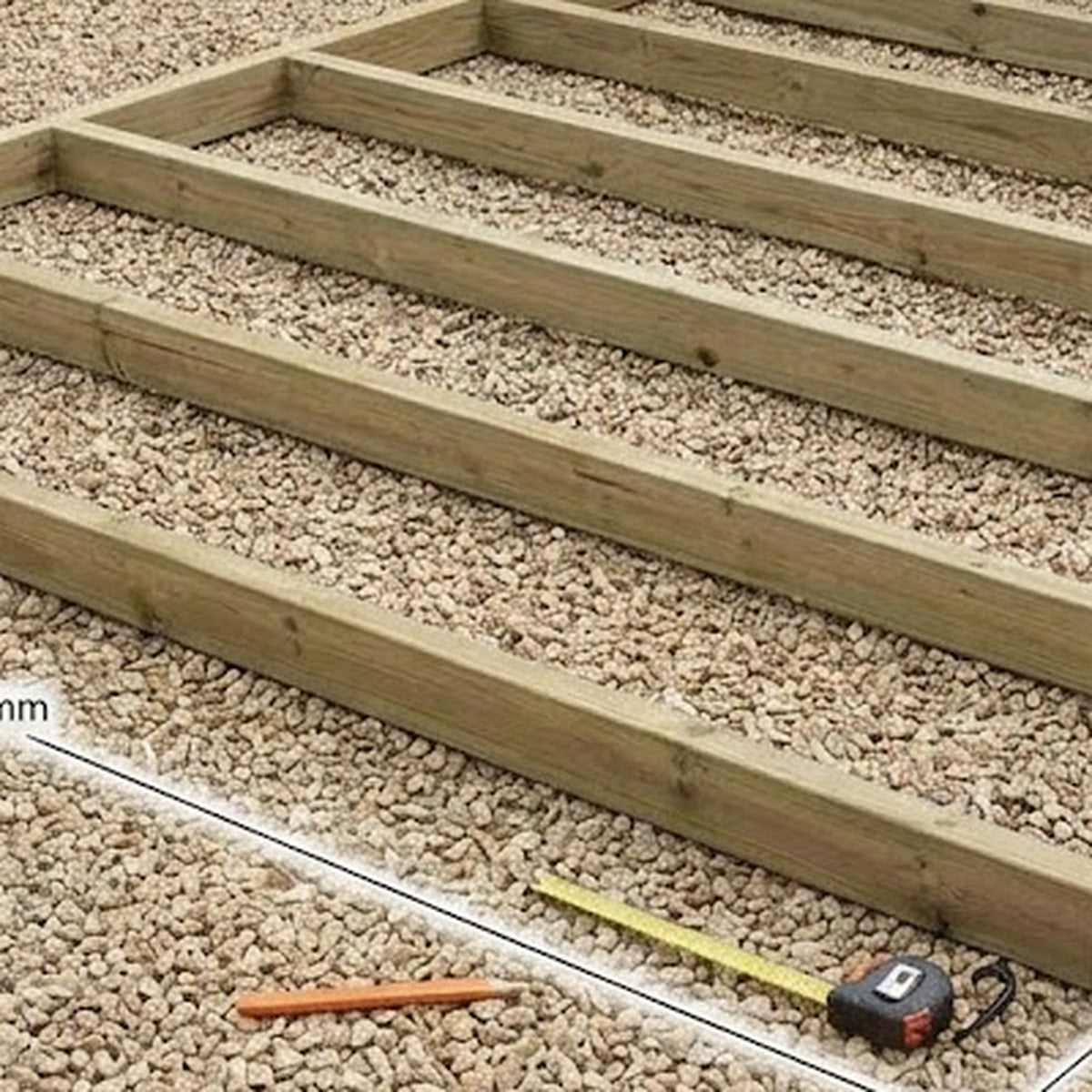 Close-up of 92 x 44 mm pressure-treated redwood timber used in shed base
