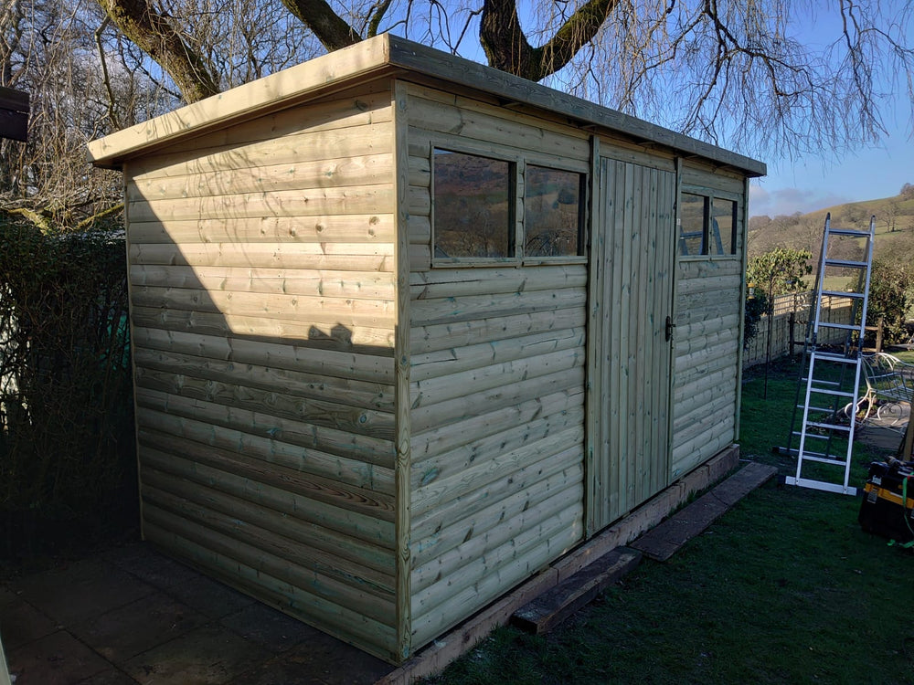 Large heavy-duty pent shed with wide central door and front windows