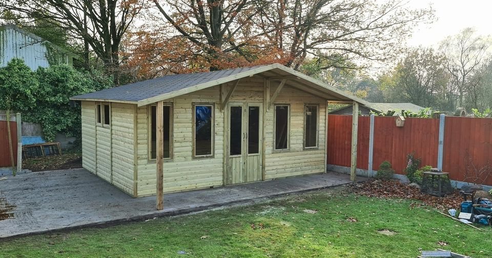 Grand 18ft x 14ft pressure-treated timber log cabin