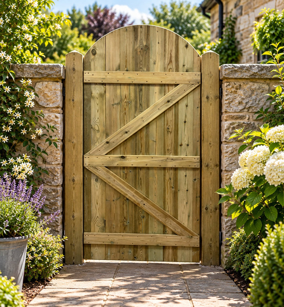 Rear of curved top tongue and groove garden gate showing timber bracing