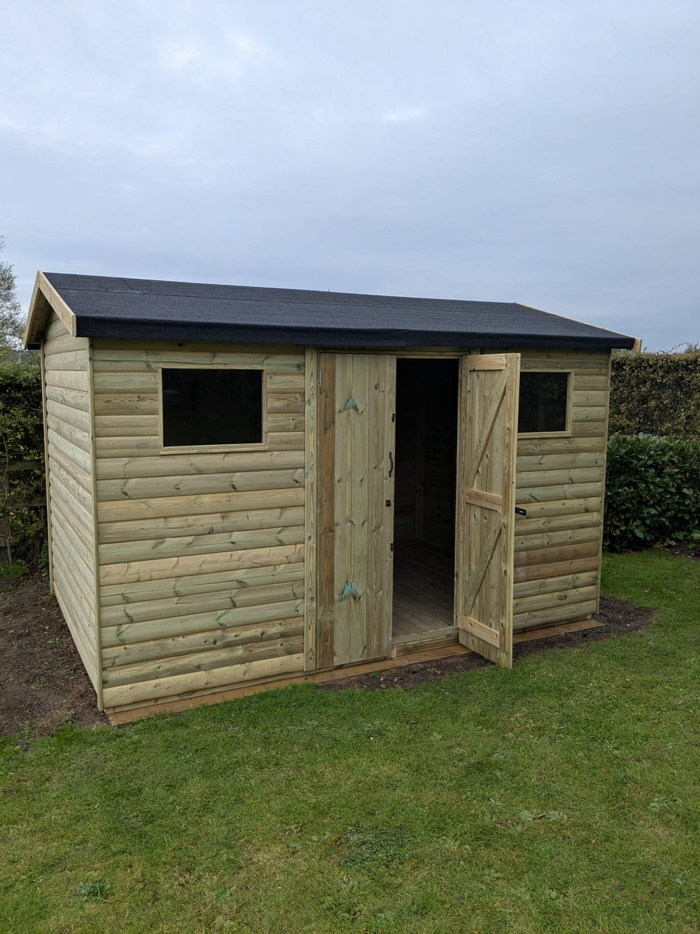 Pressure-treated Ashbourne double door shed exterior