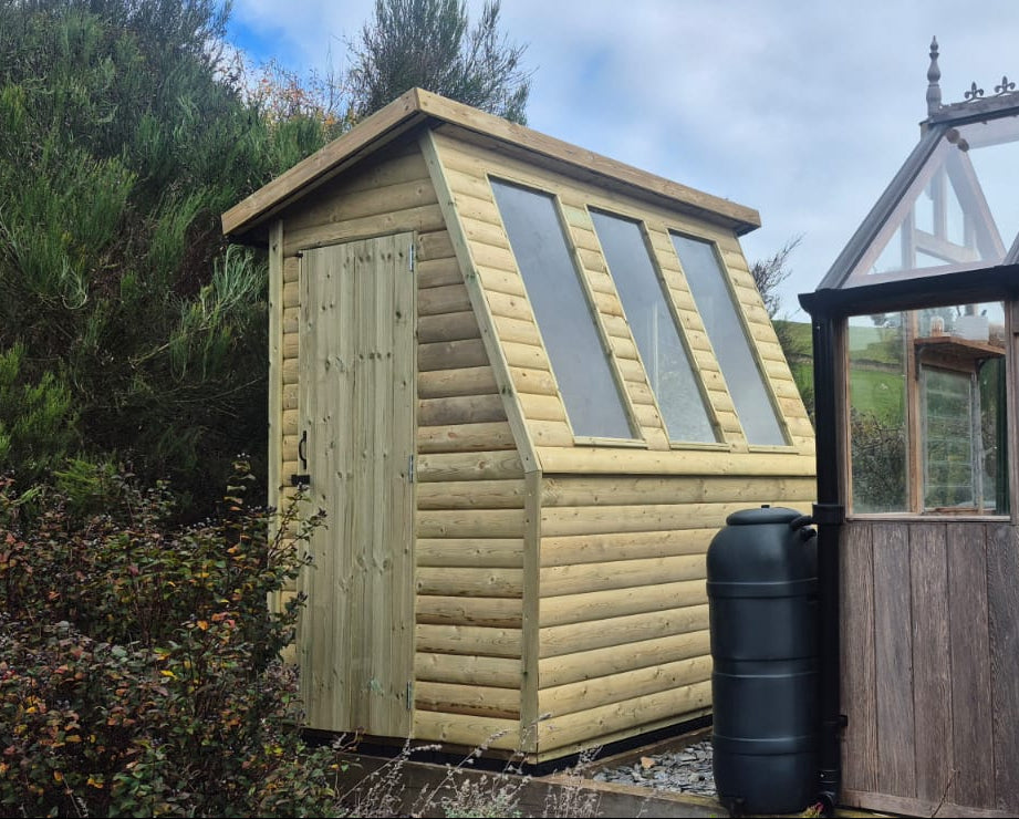 5x7 potting shed with three windows and single door